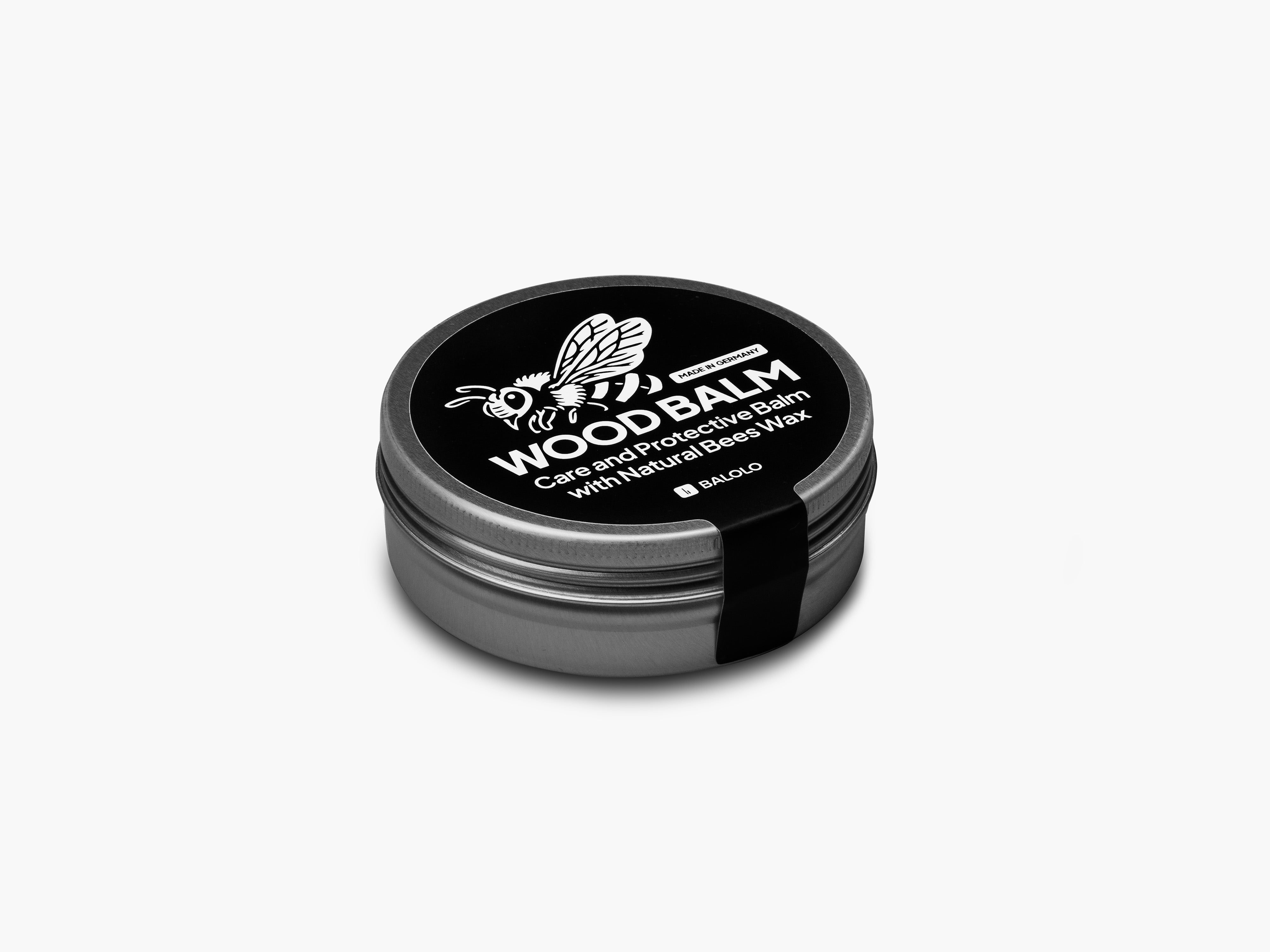 Produktfoto des Wood Balms freigestellt auf grauem Hintergrund.